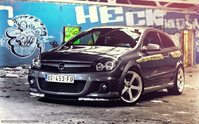 Black Opel Astra parked in alley