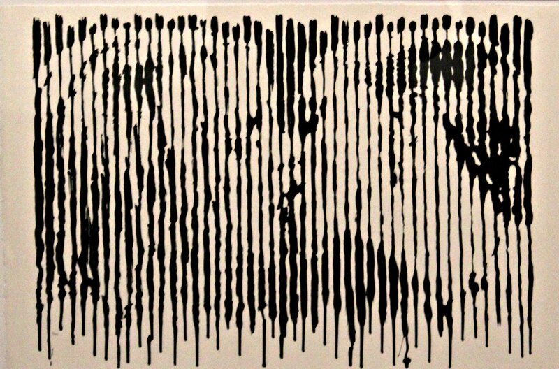 black paint drips on white background