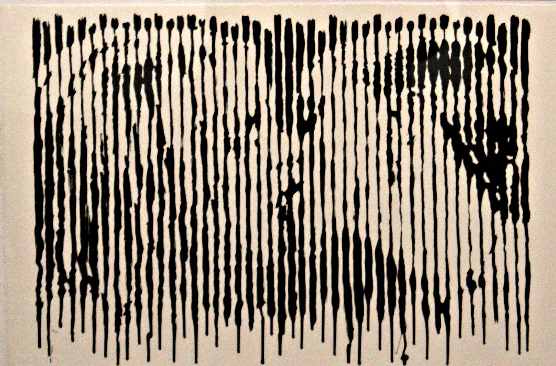 black paint drips on white background