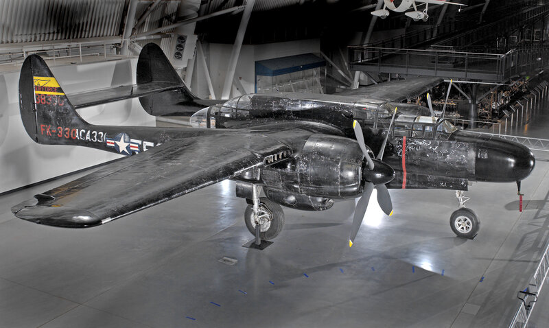 Black-painted military aircraft on display
