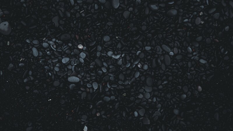Black Pebbles on Beach — Calm