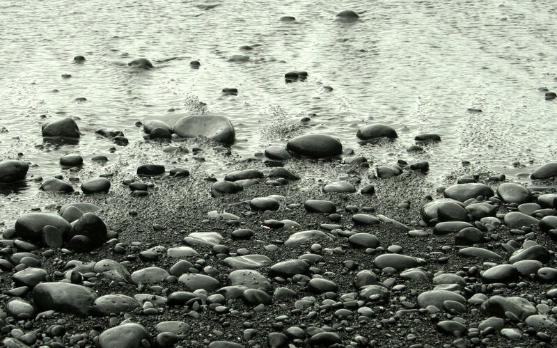Black Pebbles on Beach — Gray