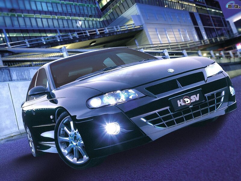 black performance sedan at night