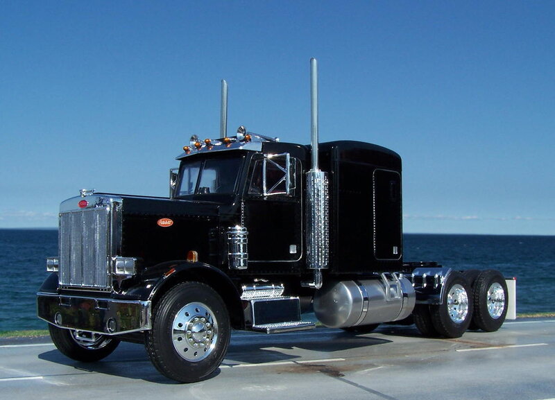 black peterbilt truck by the sea