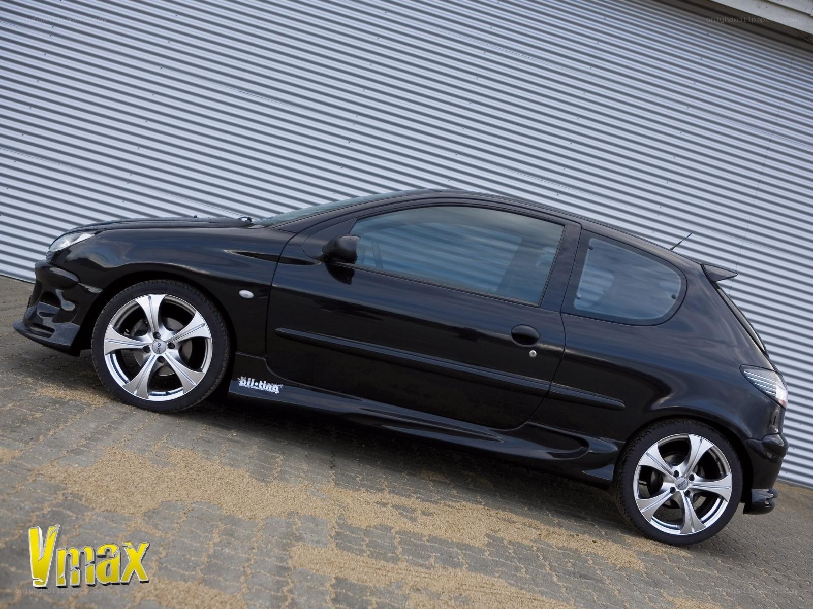 Black Peugeot 206 with custom wheels