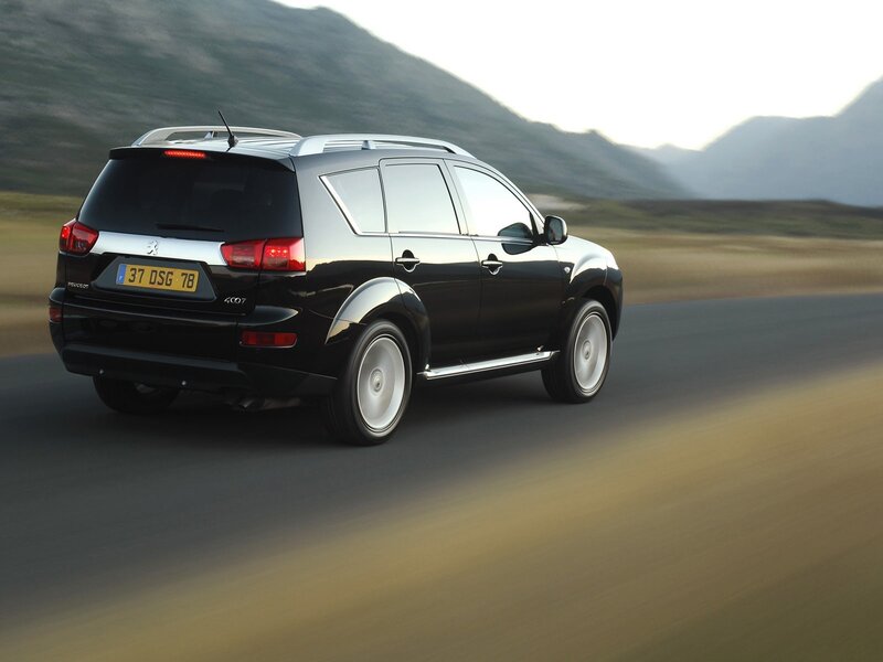 Black Peugeot 4007 on a road