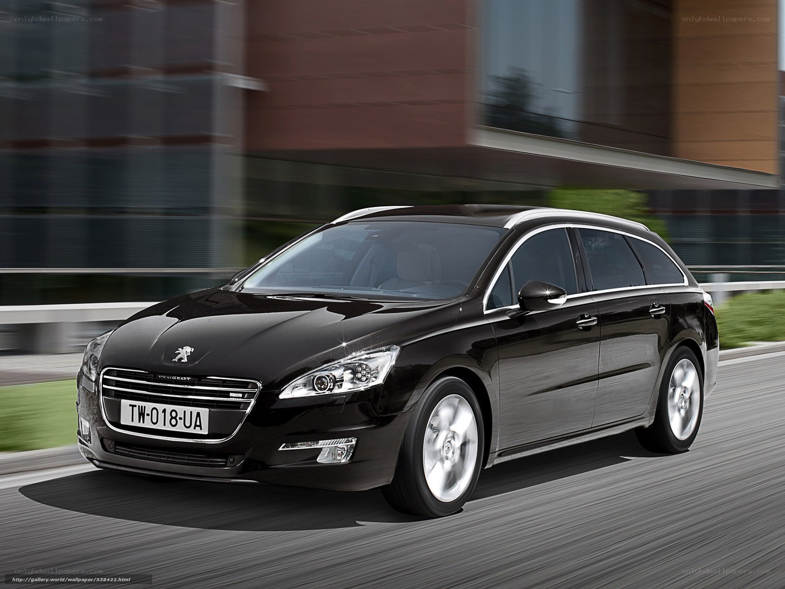 Black Peugeot 508 SW in motion