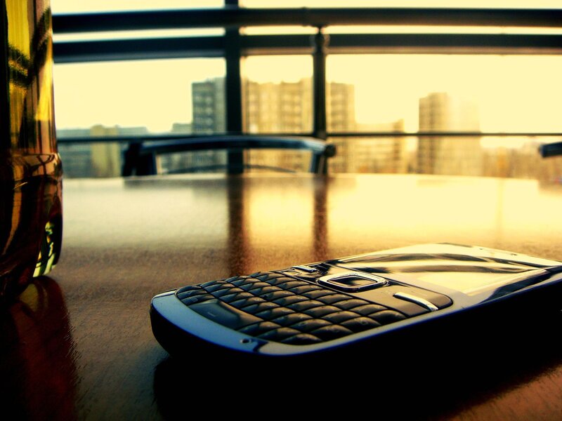 Black Phone on Table — Brown, Calm, Sunset
