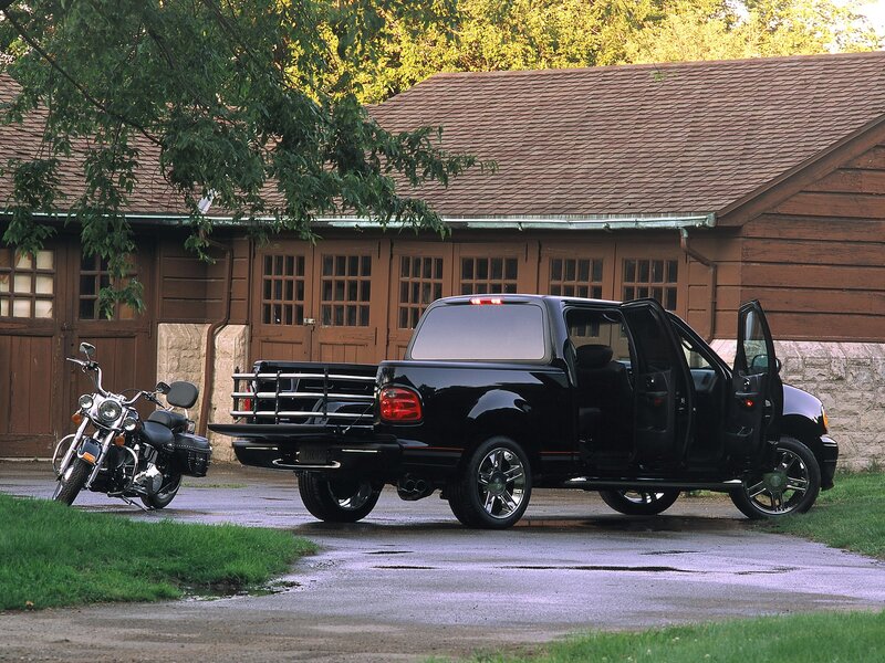 Black pickup truck and motorcycle