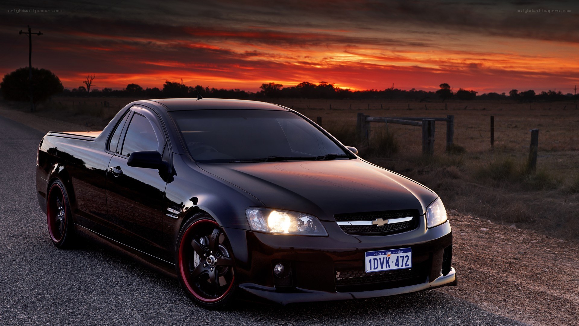 Black pickup truck at sunset