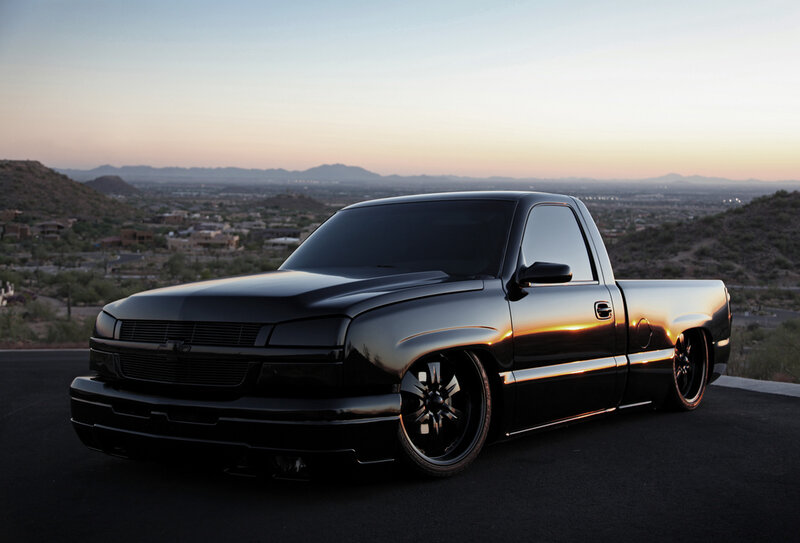 black pickup truck at sunset