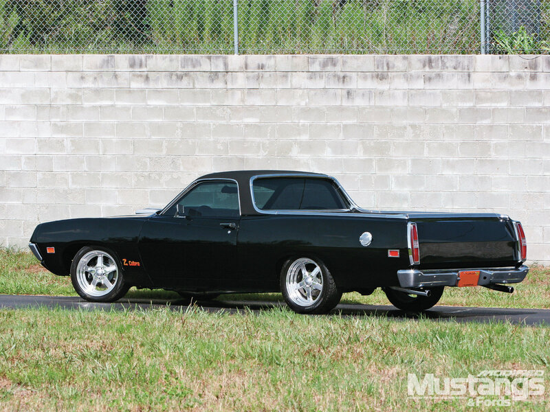 Black Pickup Truck — Calm, Afternoon, Photograph, Concrete Wall