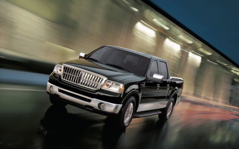 Black pickup truck in motion