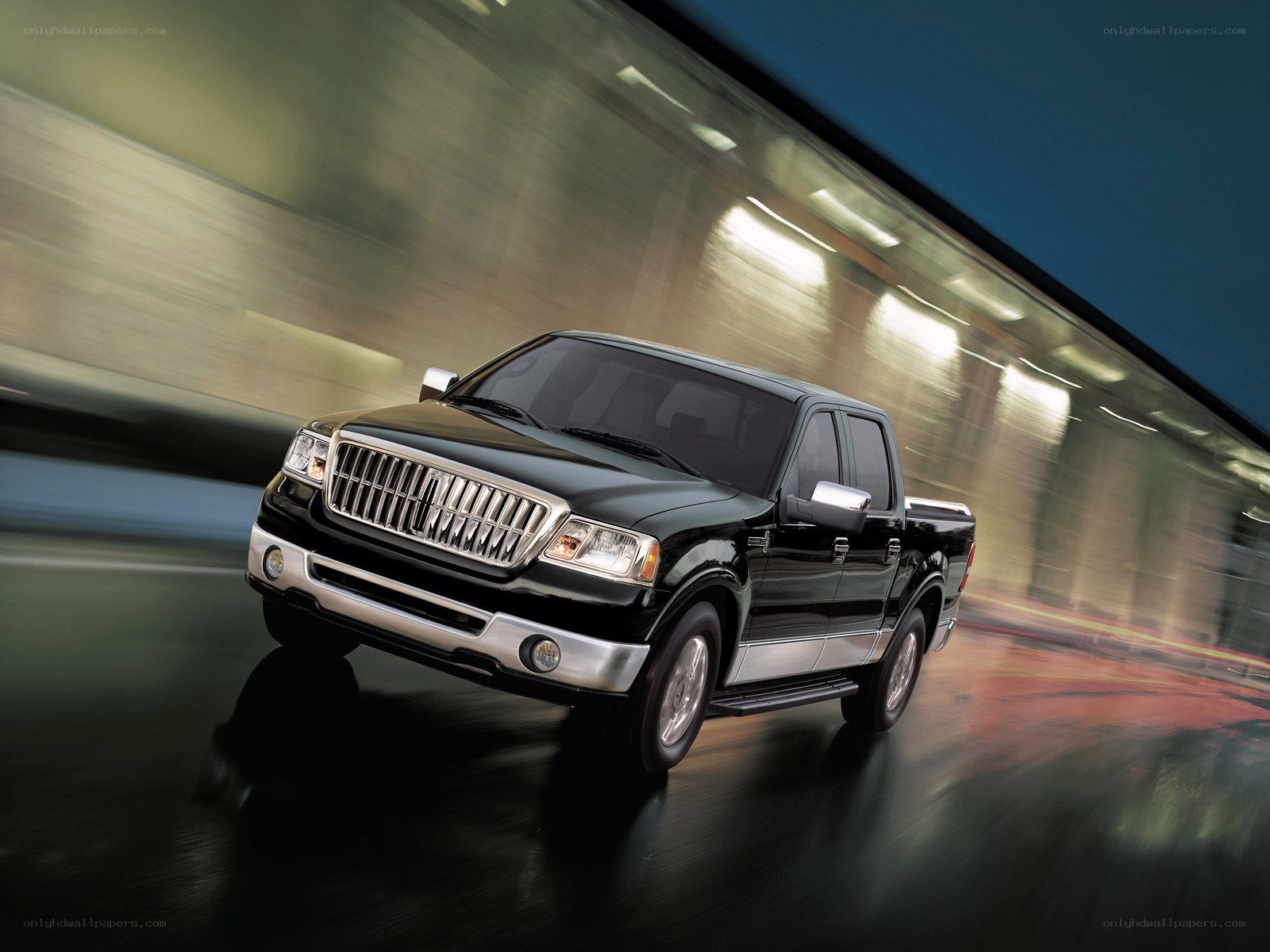 Black pickup truck in motion