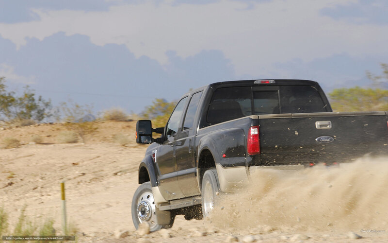 black pickup truck on dirt road