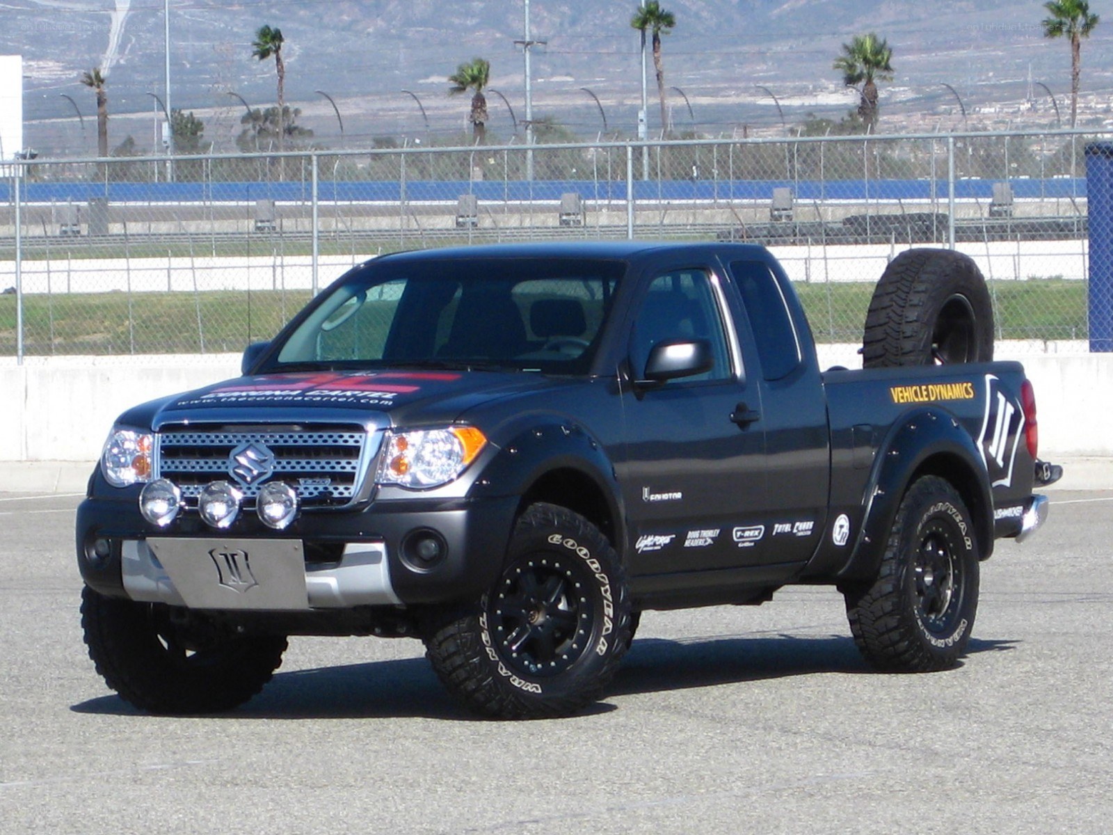 black pickup truck on racetrack