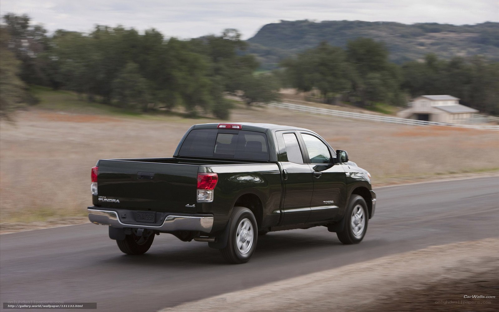 black pickup truck on rural road