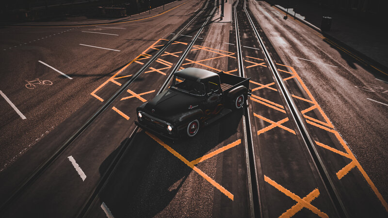 Black Pickup Truck on Tracks