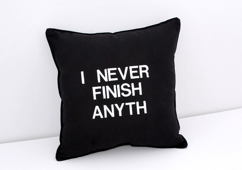 Black Pillow with Text — Minimalist