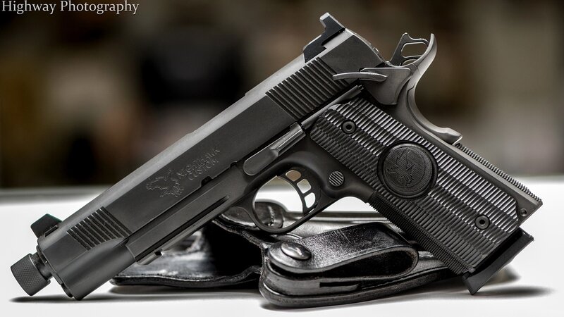 black pistol on holster