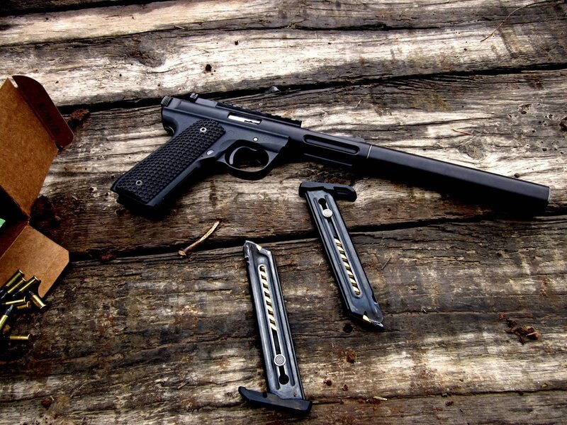 Black pistol with magazines
