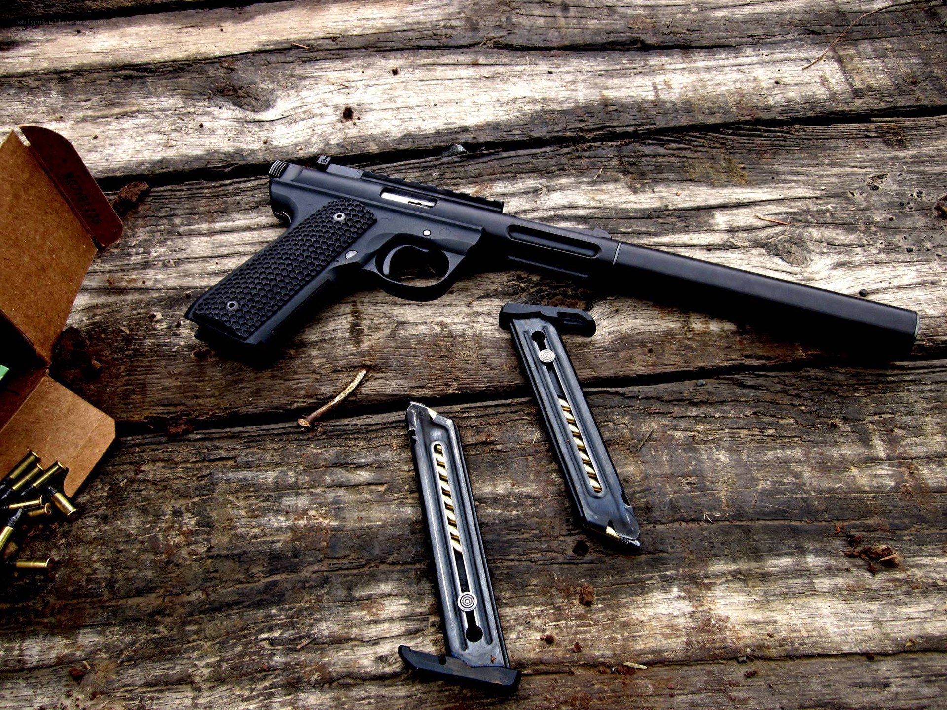 Black pistol with magazines