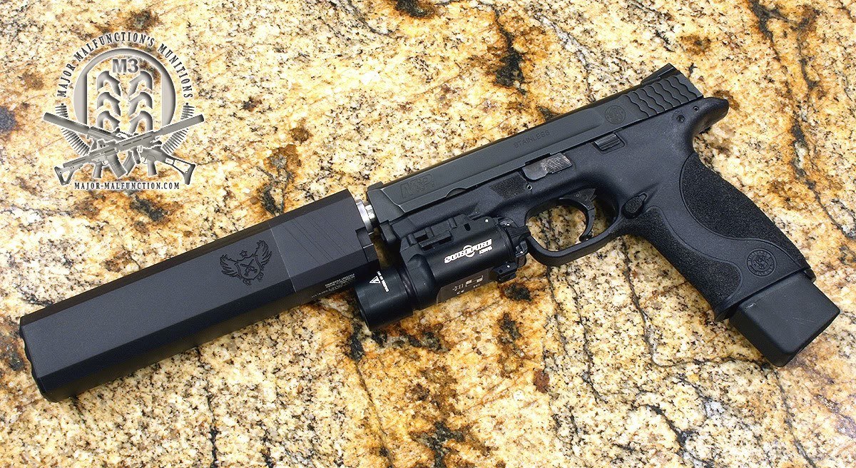 Black pistol with suppressor