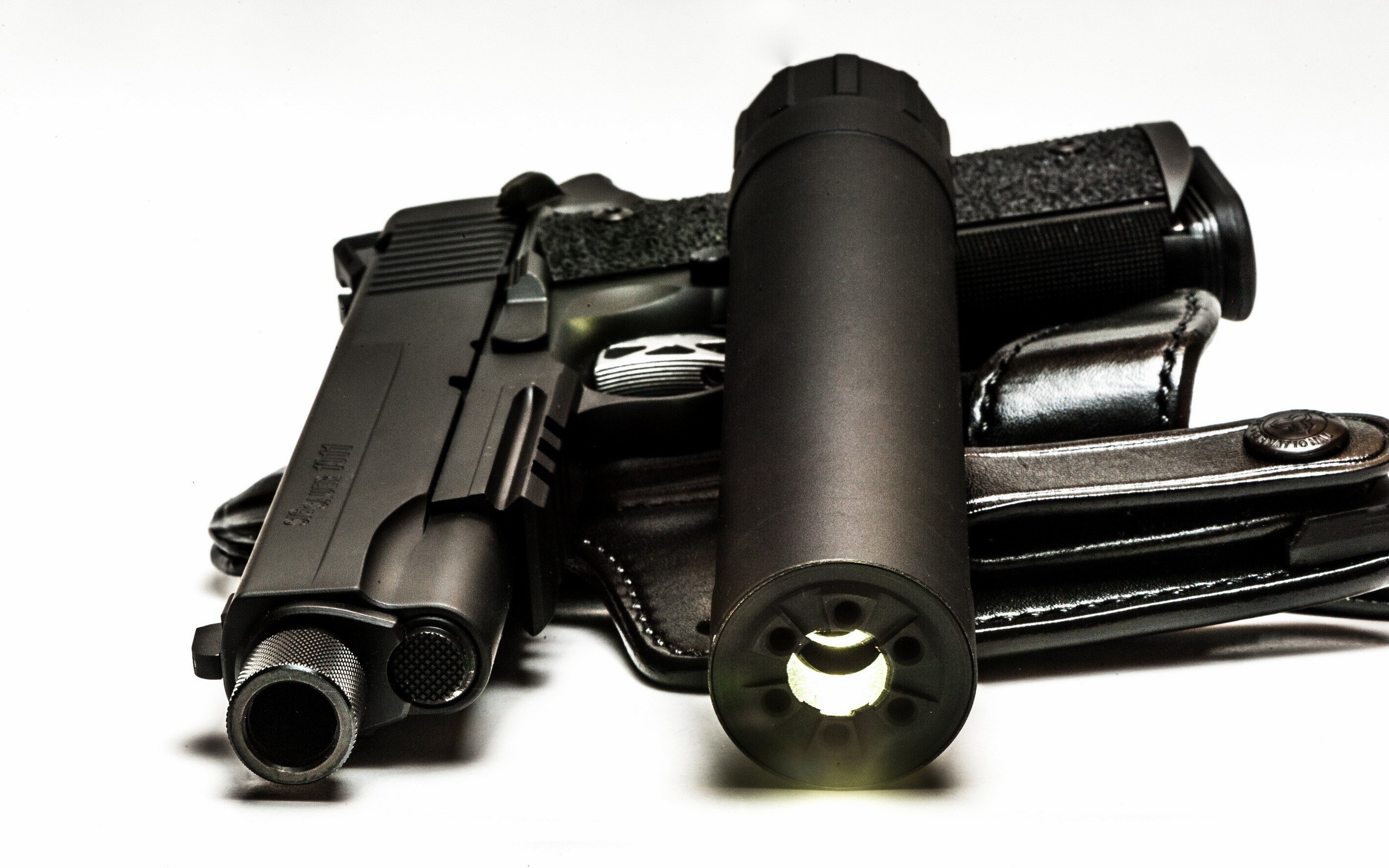 black pistol with suppressor