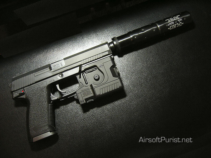 Black Pistol with Suppressor — Dramatic