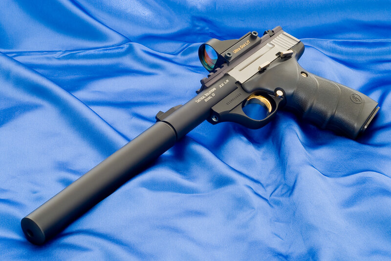 Black pistol with suppressor