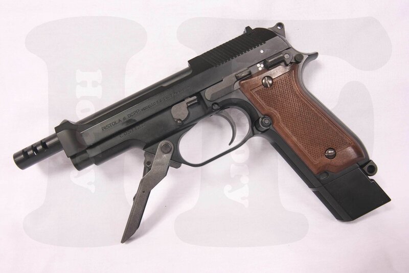 black pistol with wooden grip