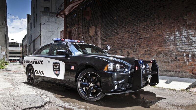 Black Police Car — Dramatic, Afternoon, Photograph, Brick Wall