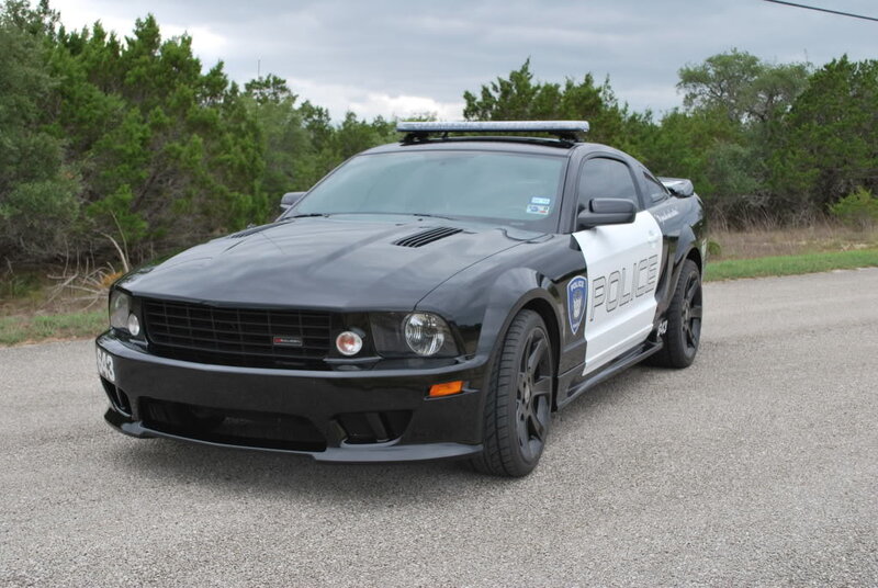 black police car on road