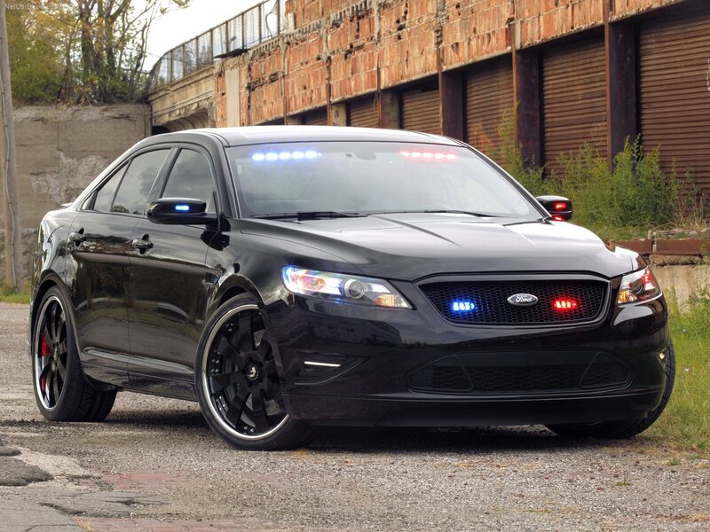 black police sedan with lights