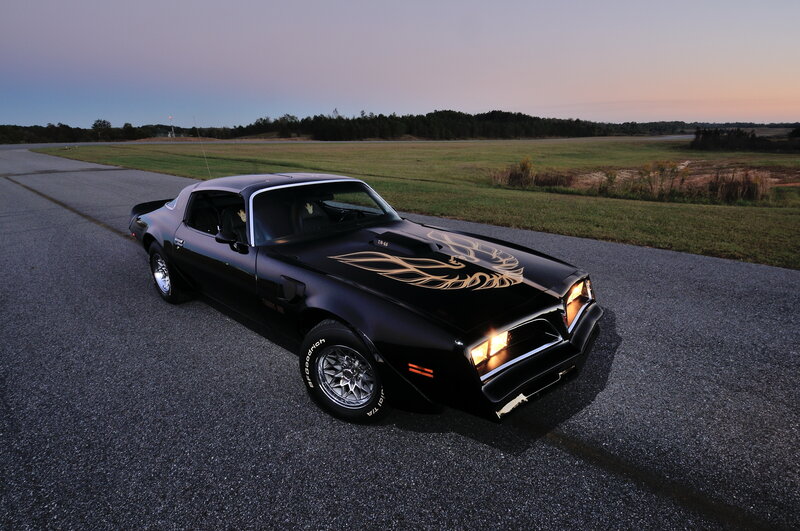 Black Pontiac Firebird at dusk