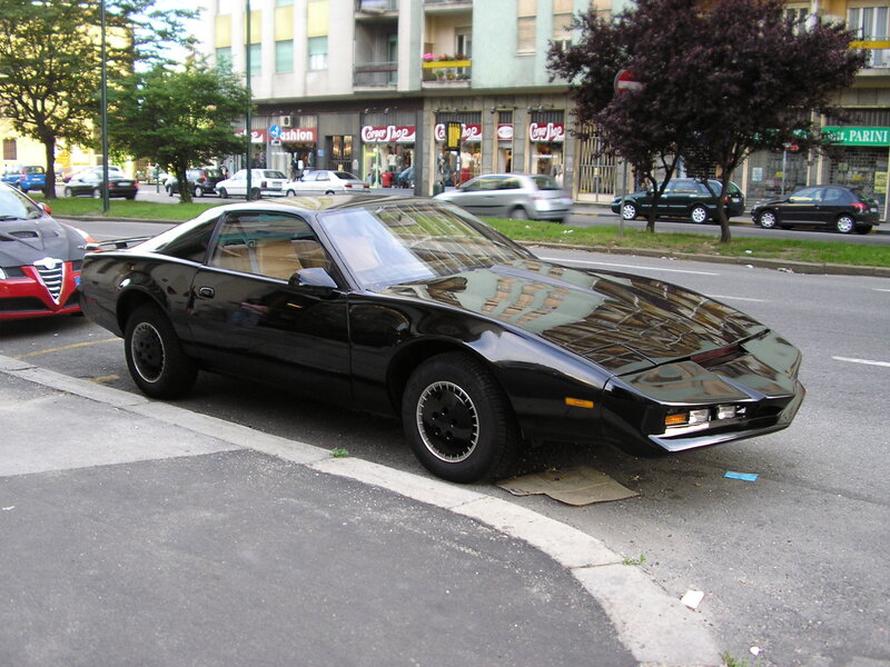 Black Pontiac Firebird parked on street