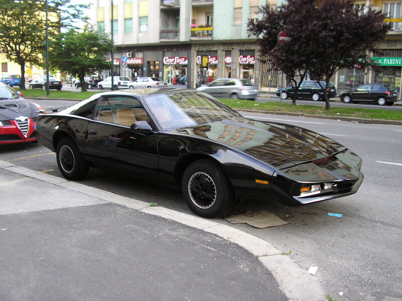 Black Pontiac Firebird parked on street
