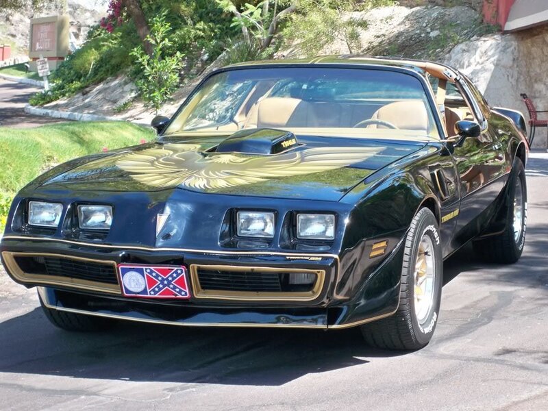 Black Pontiac Firebird with gold accents
