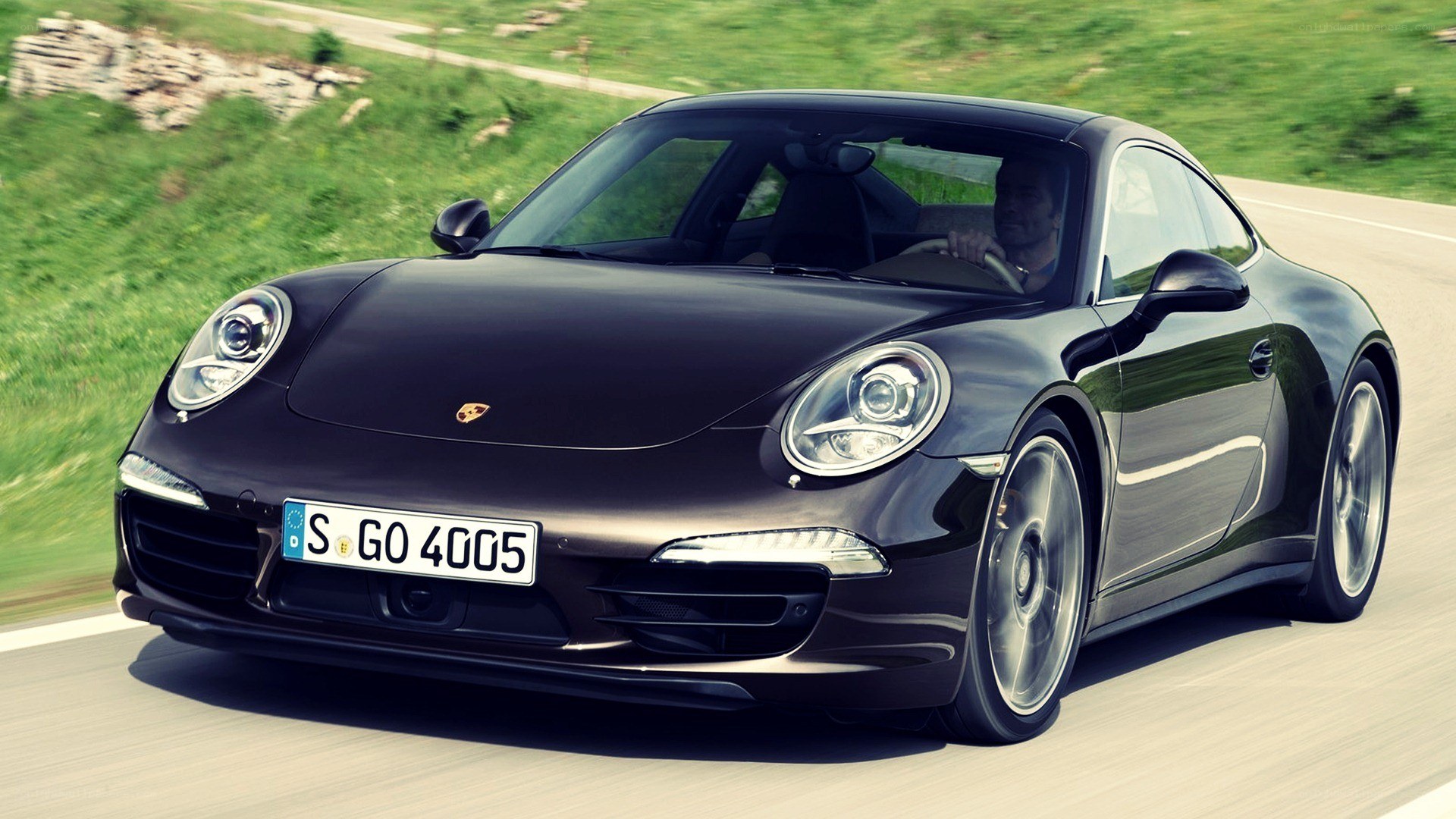 Black Porsche 911 in motion