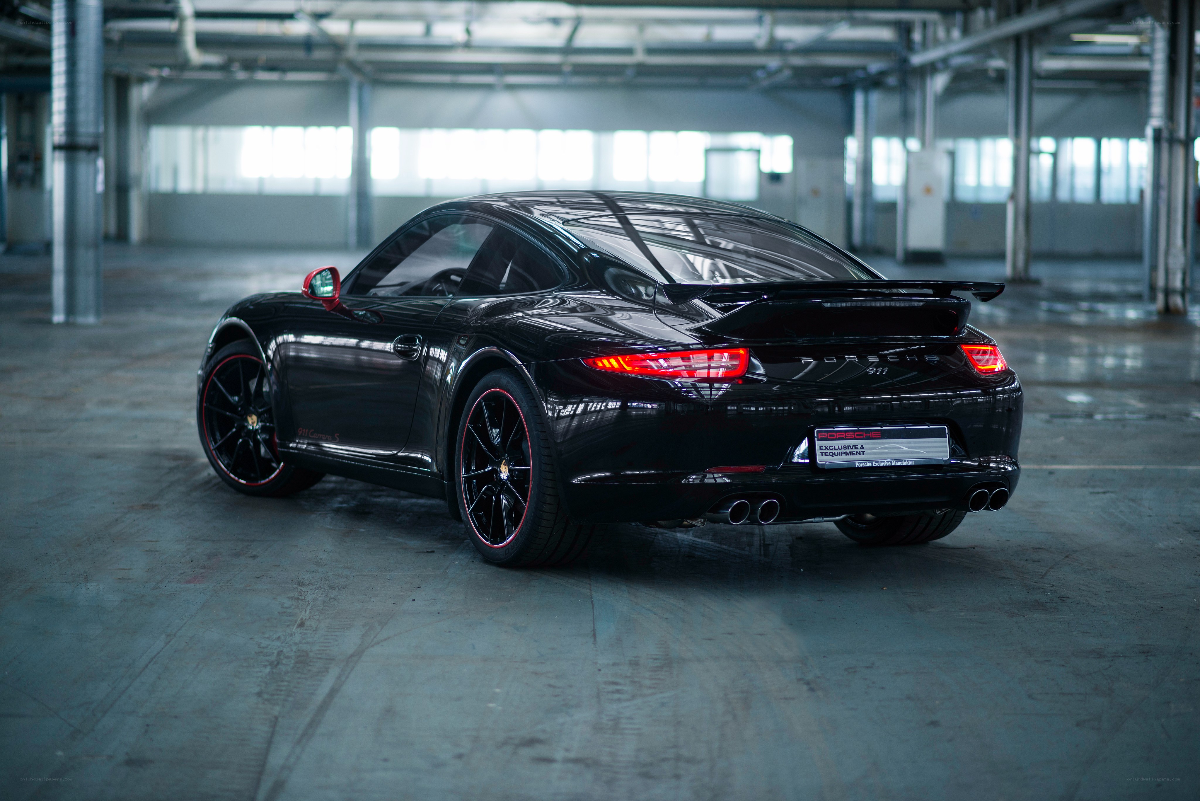 Black Porsche 911 in warehouse