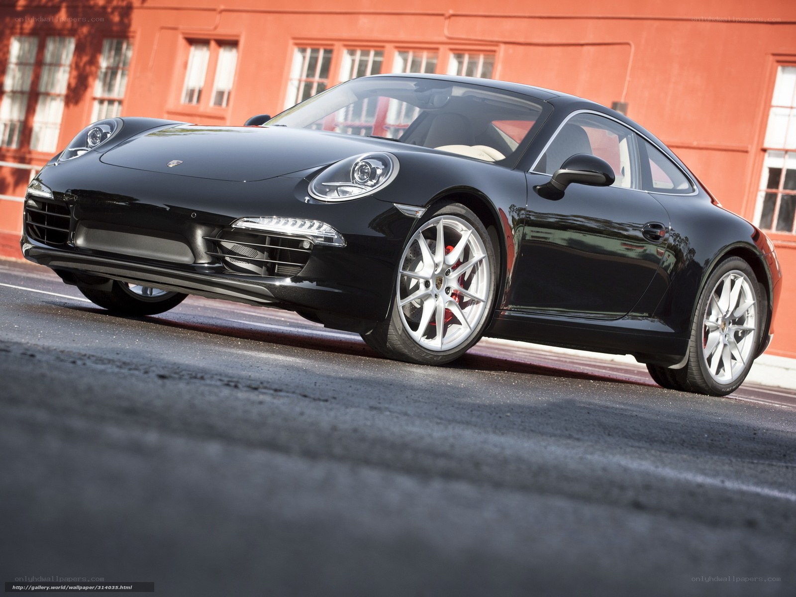 Black Porsche 911 on city street