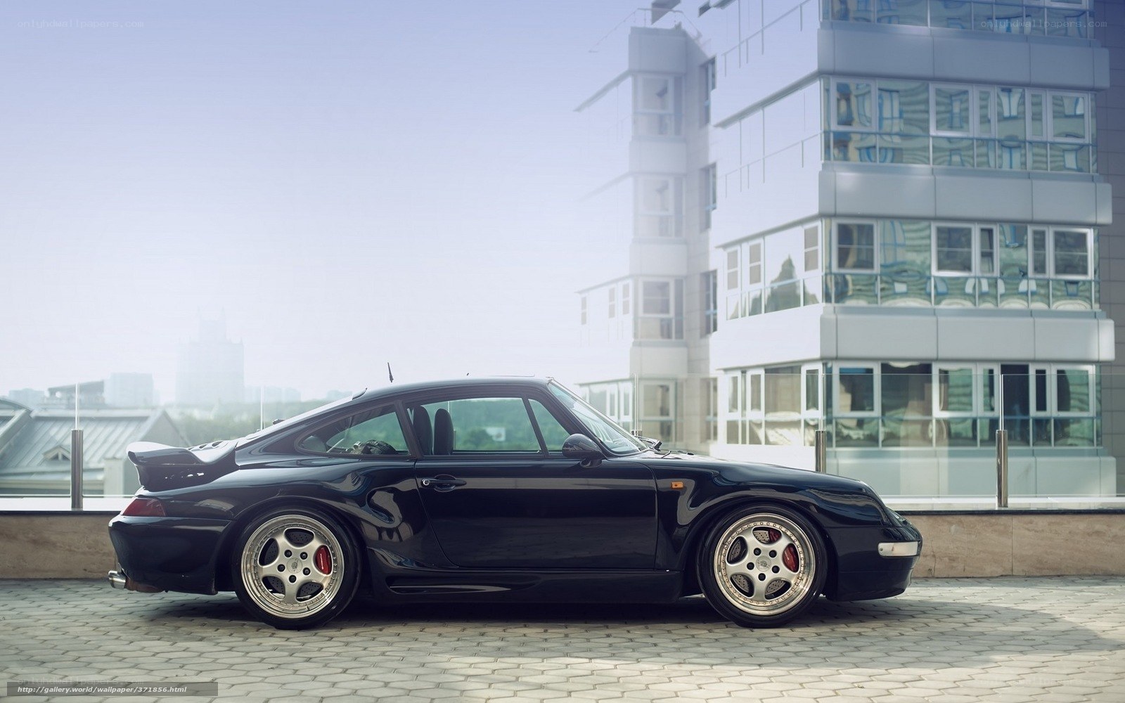 Black Porsche 911 on rooftop