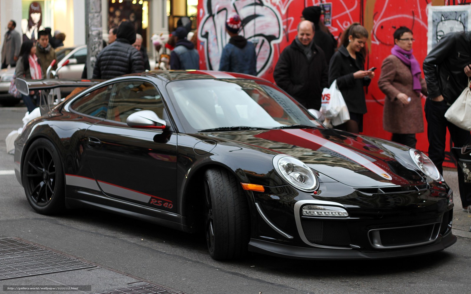 Black Porsche 911 RS 4.0 on city street