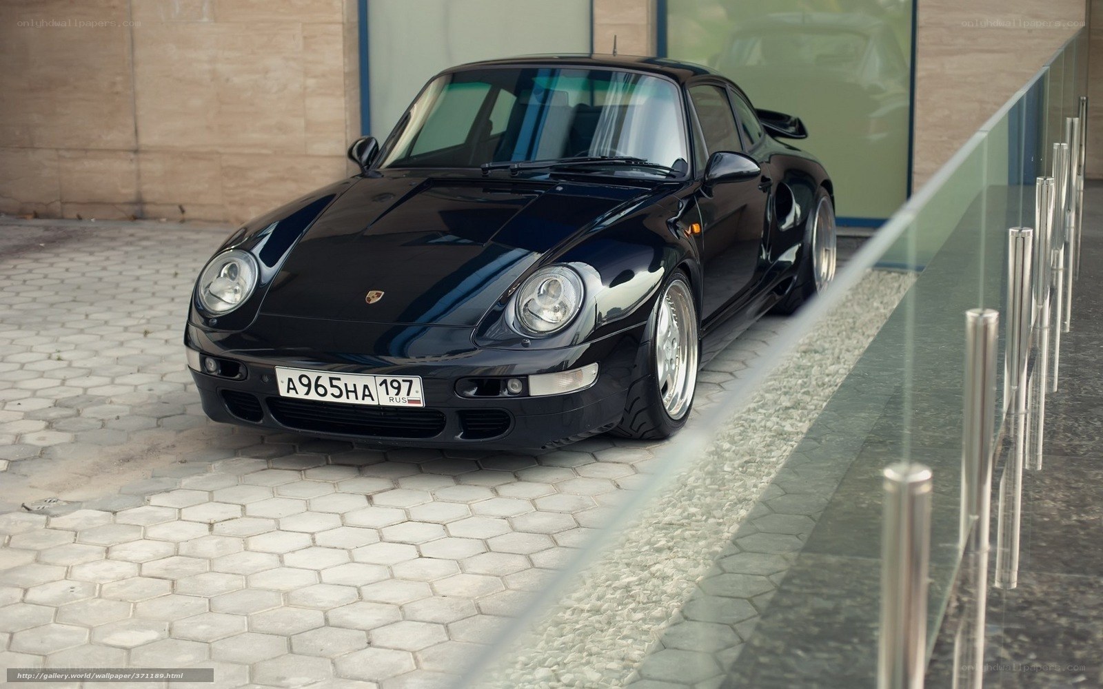 Black Porsche 968 parked outside