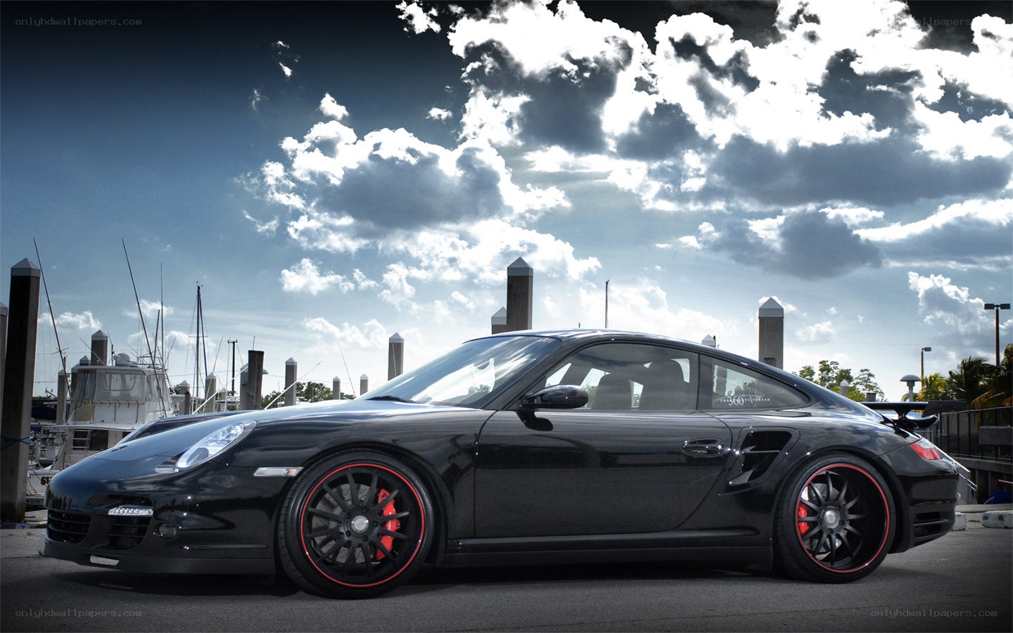 Black Porsche at marina