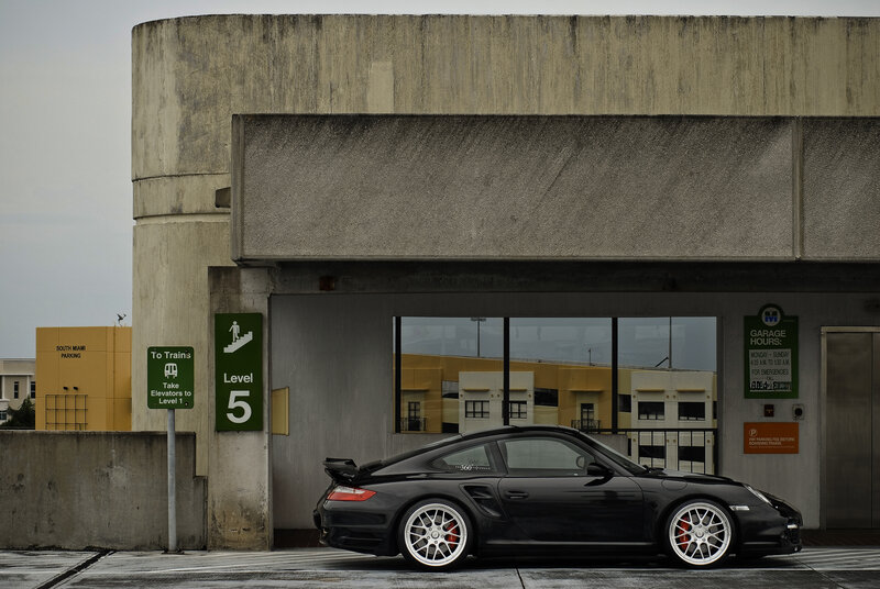 Black Porsche at parking garage