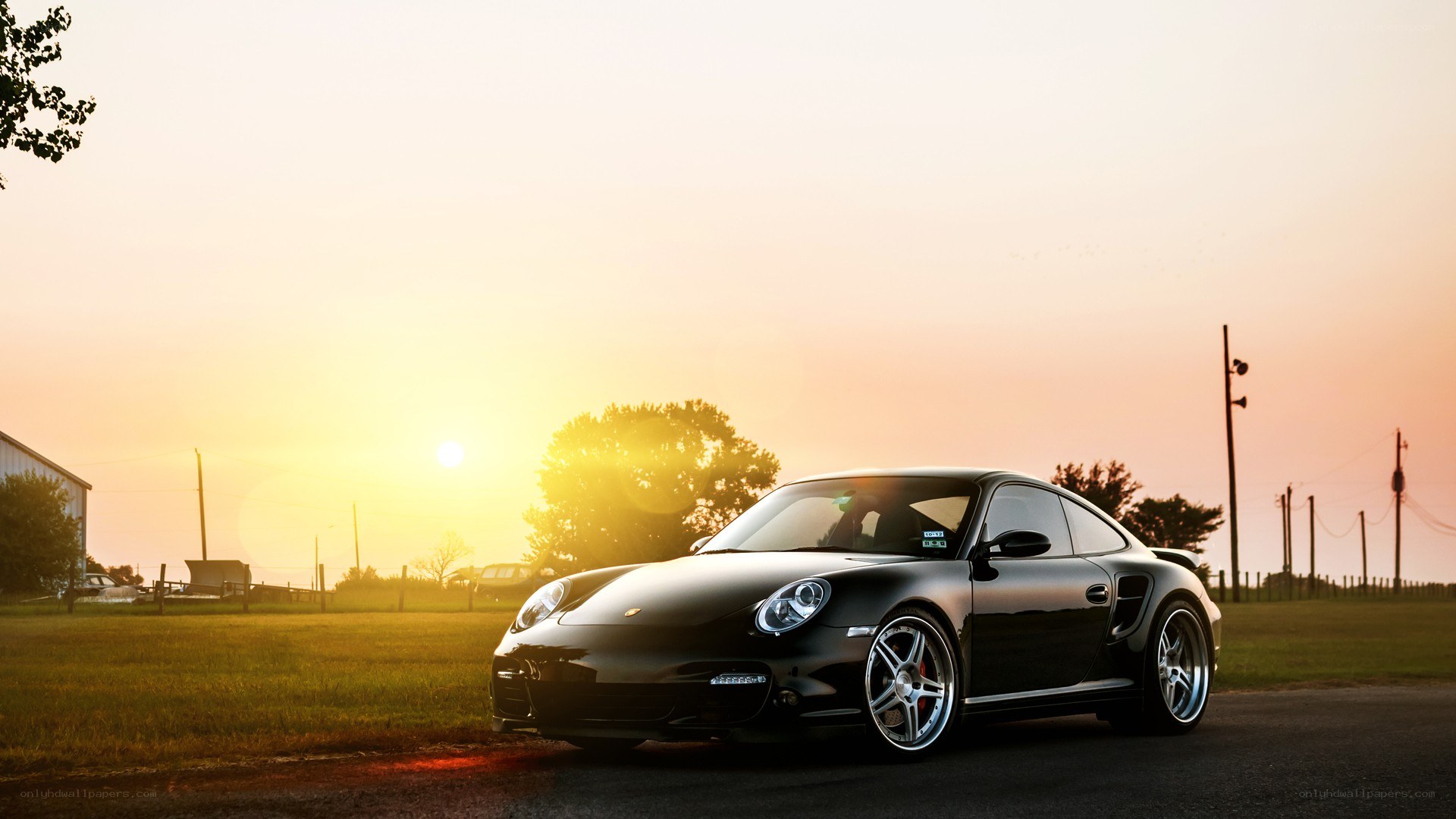 black porsche at sunset
