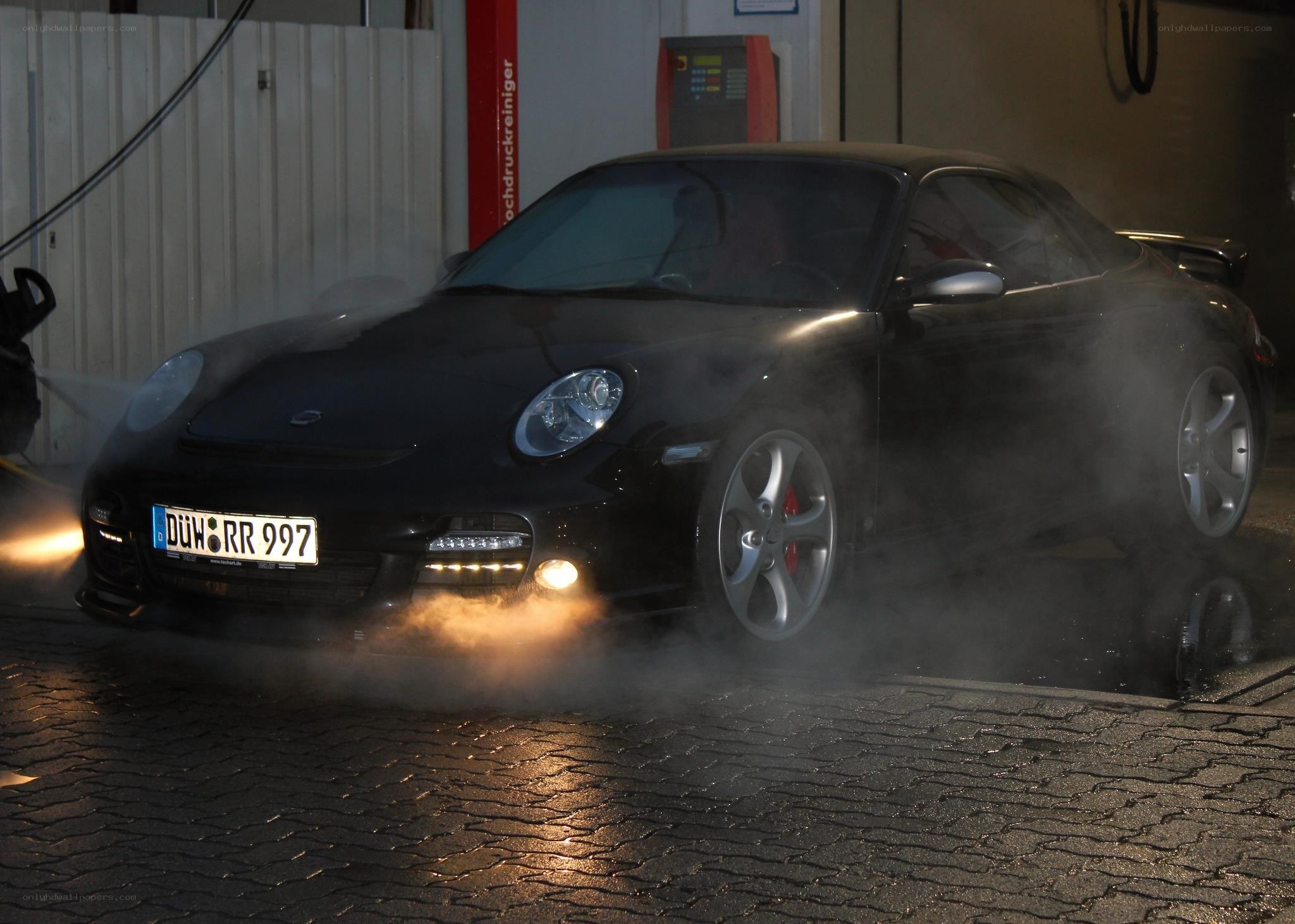 Black Porsche being washed