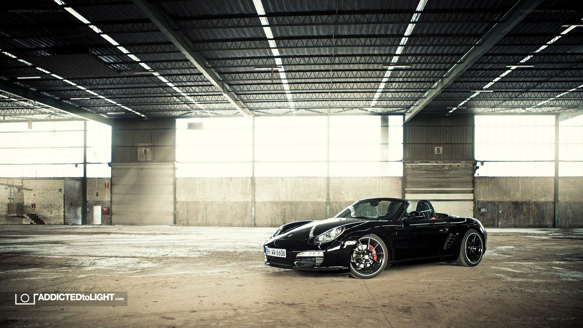 Black Porsche Boxster in warehouse