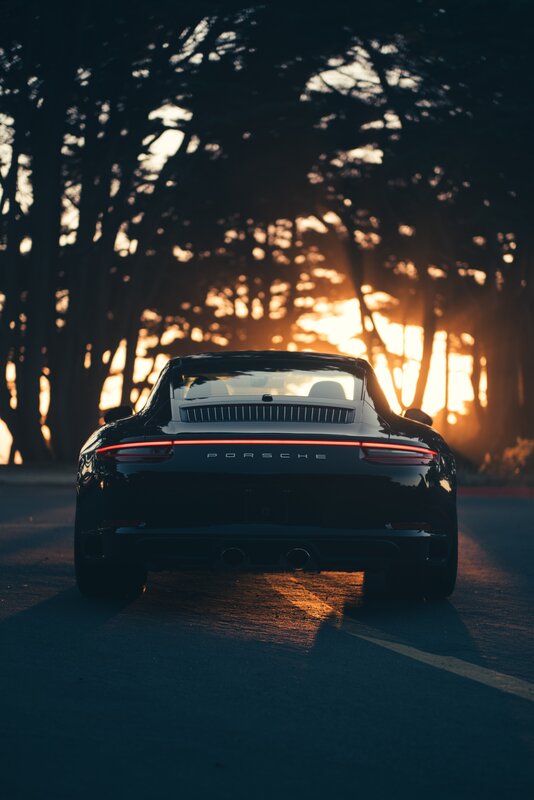 Black Porsche Car — Dramatic, Sunset, Photograph